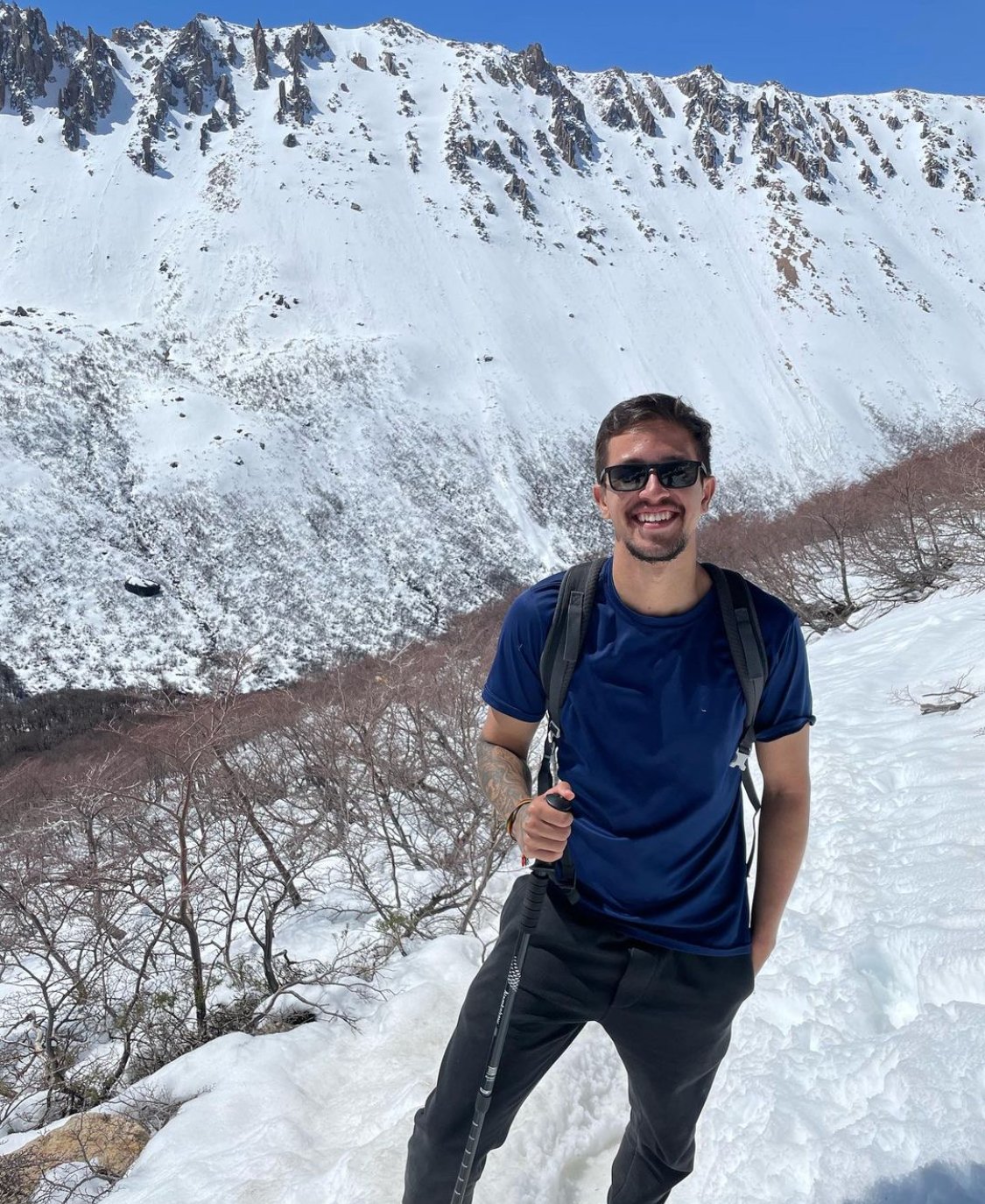 Arthur hiking on a snow-covered slope